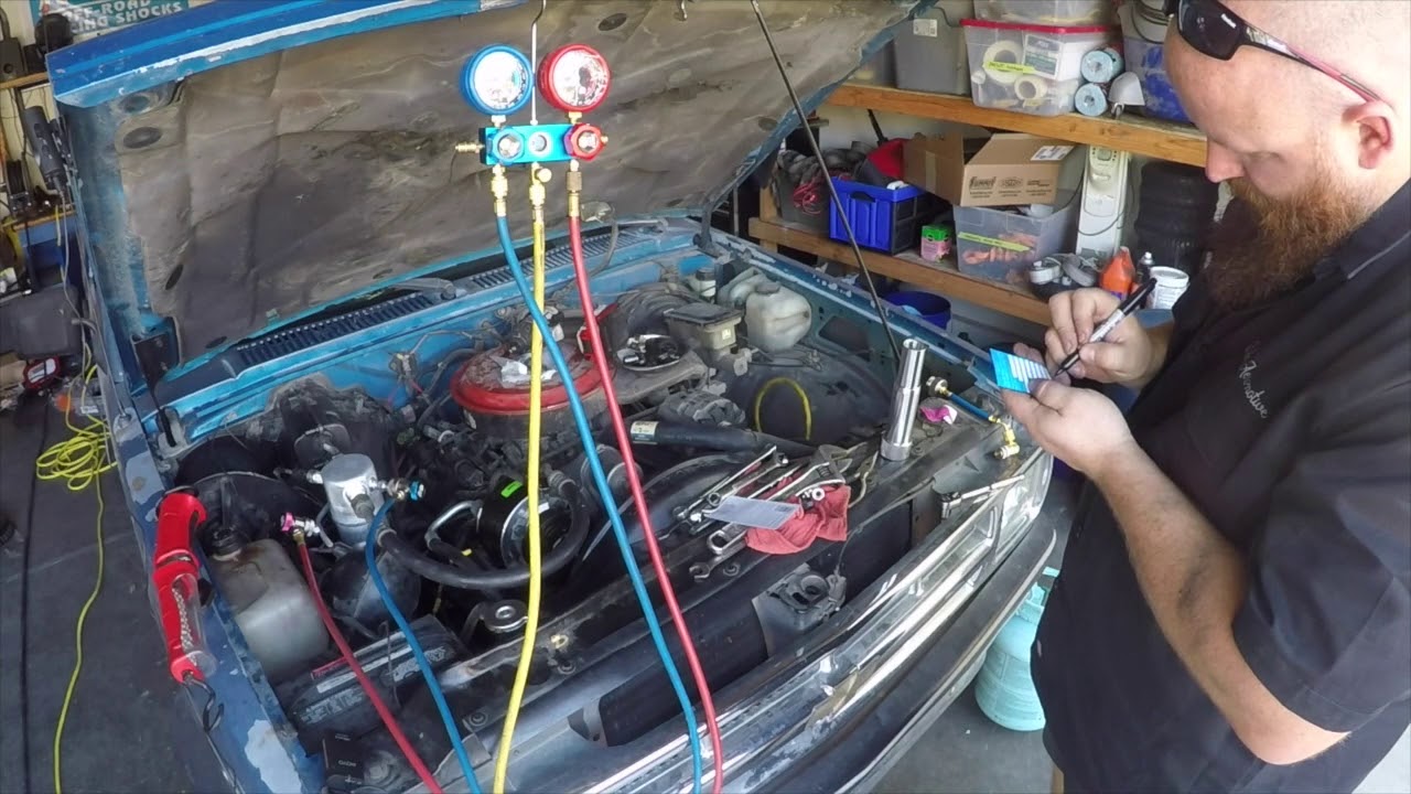 Technician performing car AC repair at Marwat Garage in Ajman and Sharjah