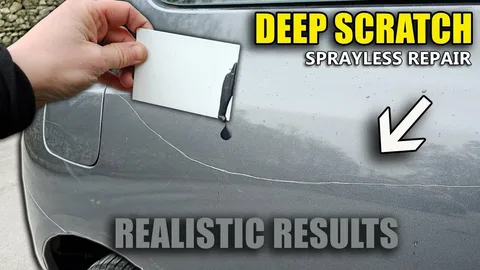 Close-up of car paint scratch showing surface damage on vehicle door